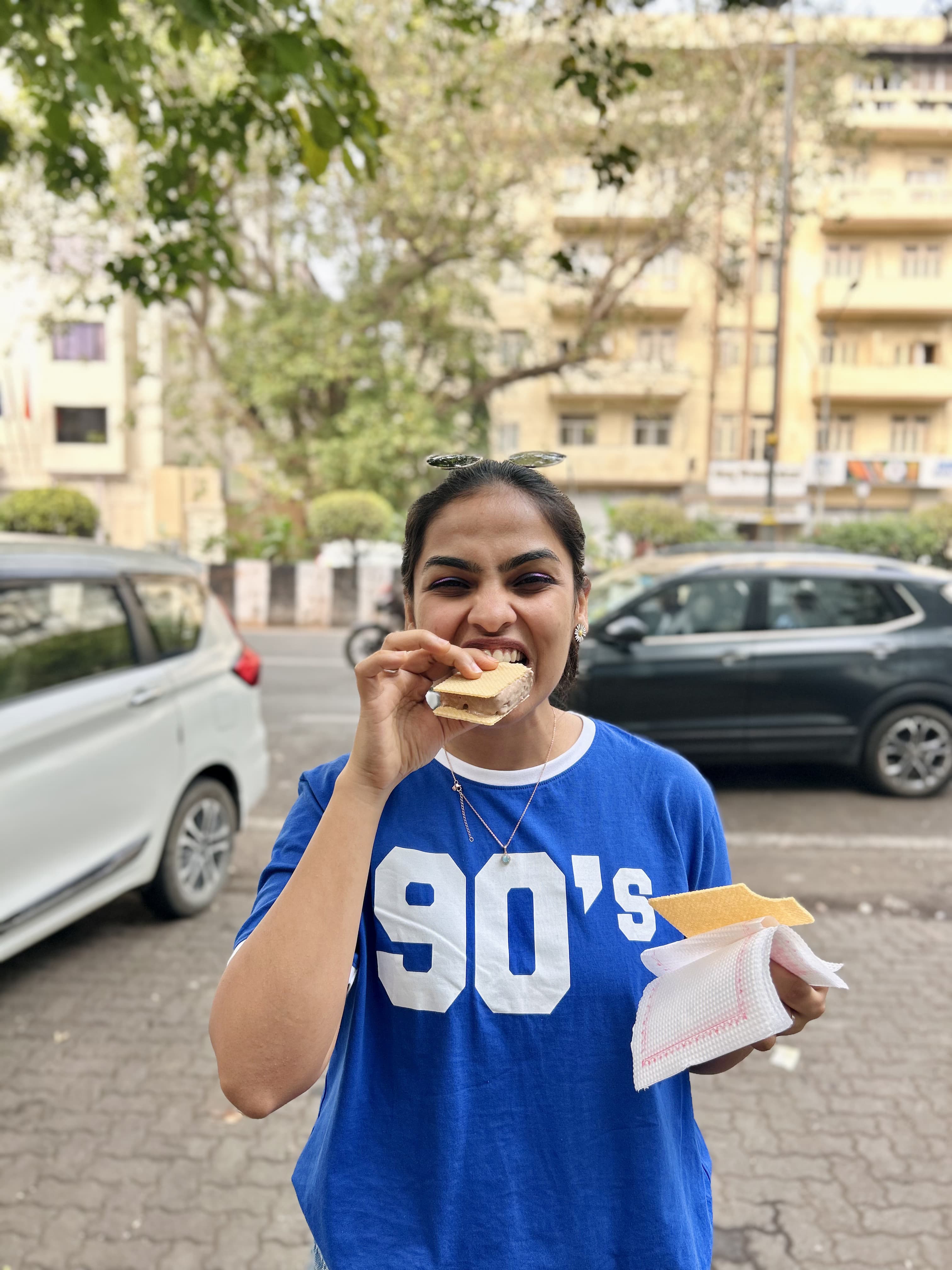 Dinashree enjoying a drink at a cafe