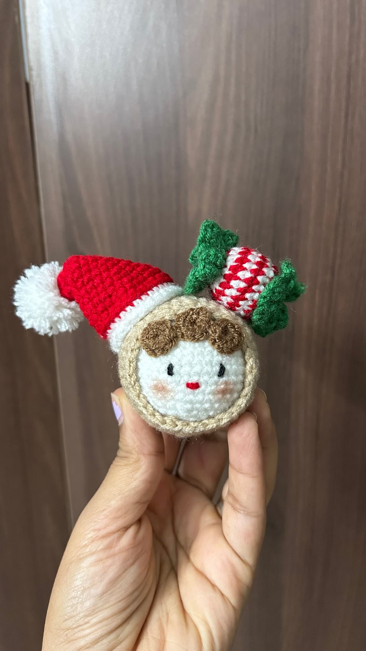 Christmas crochet ornament with a tiny hat and candy cane